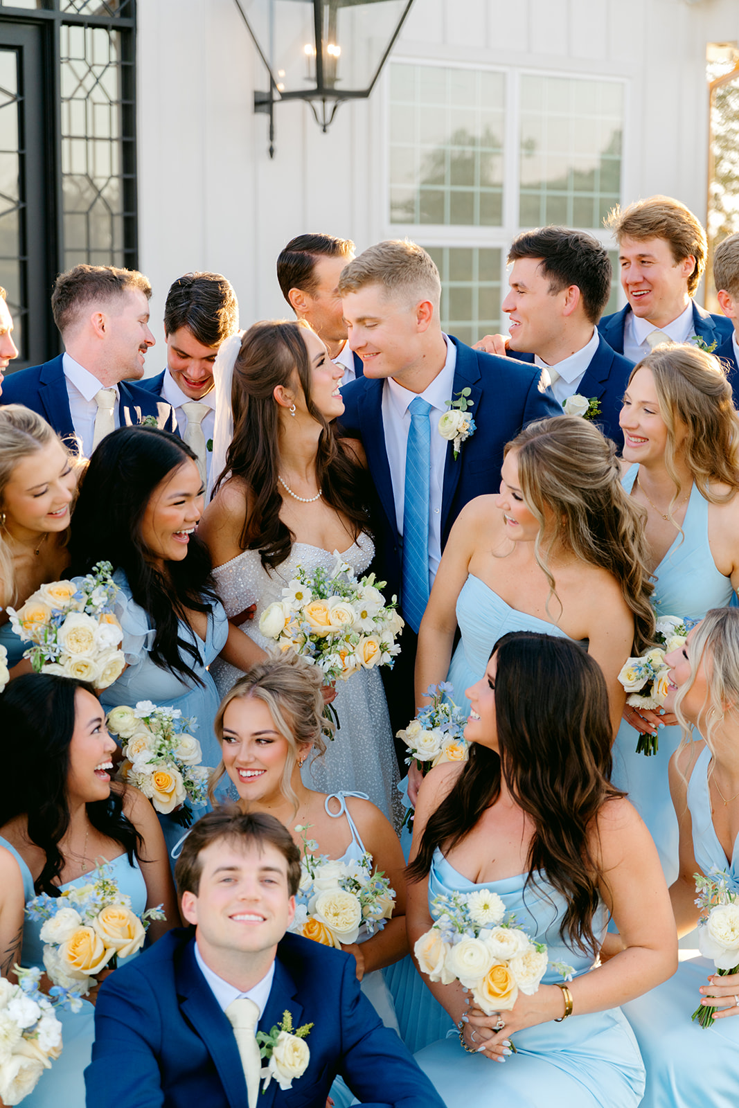 Bride and groom with their wedding party at their Camp Hosea wedding