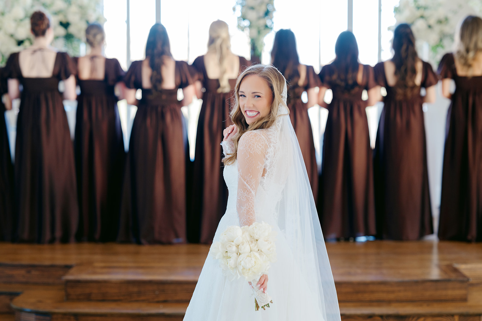 Bride has first look with bridesmaids at Weinberg at Wixon Valley