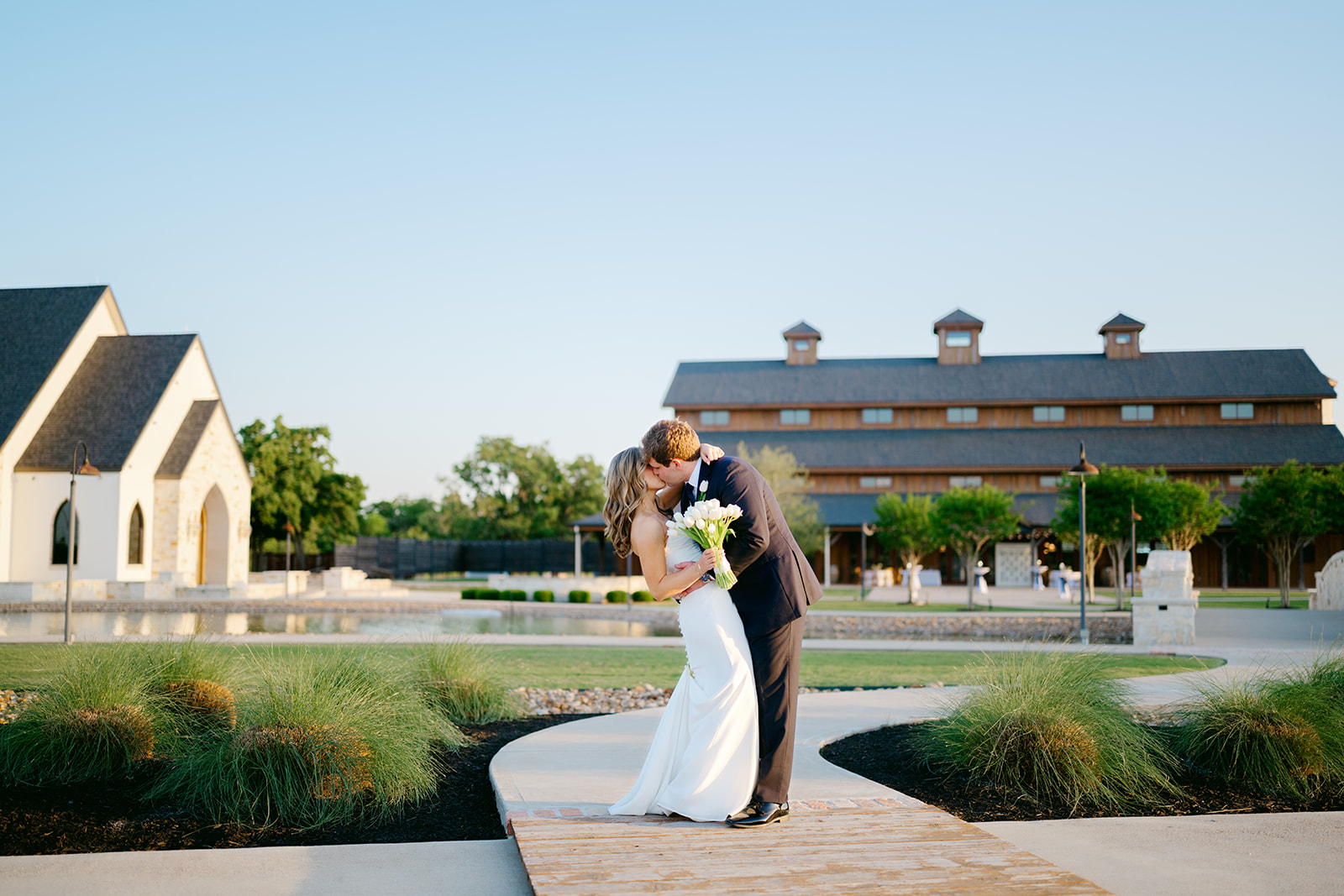Bride and groom kiss at The Weinberg at Wixon Valley