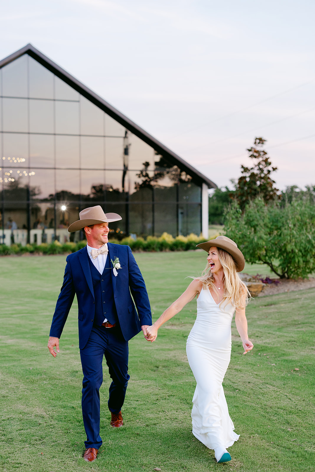 Bride and groom photographed by second photographer at wedding