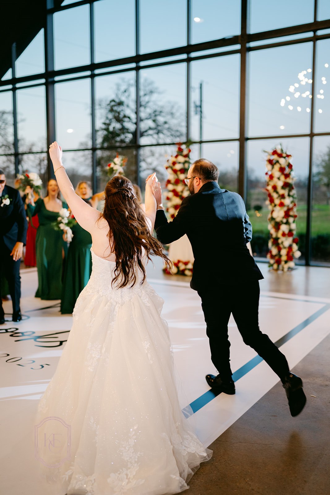 Bride and groom enter wedding reception