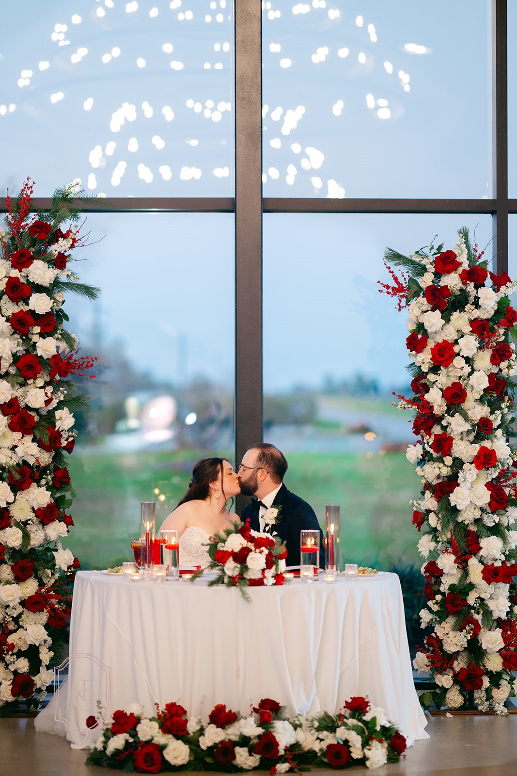 Bride and groom kiss at wedding reception