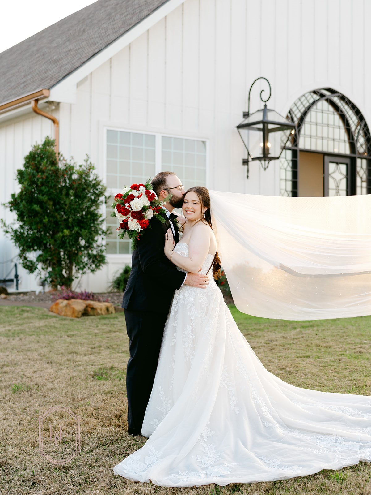 Bride and groom pose for outdoor wedding portraits