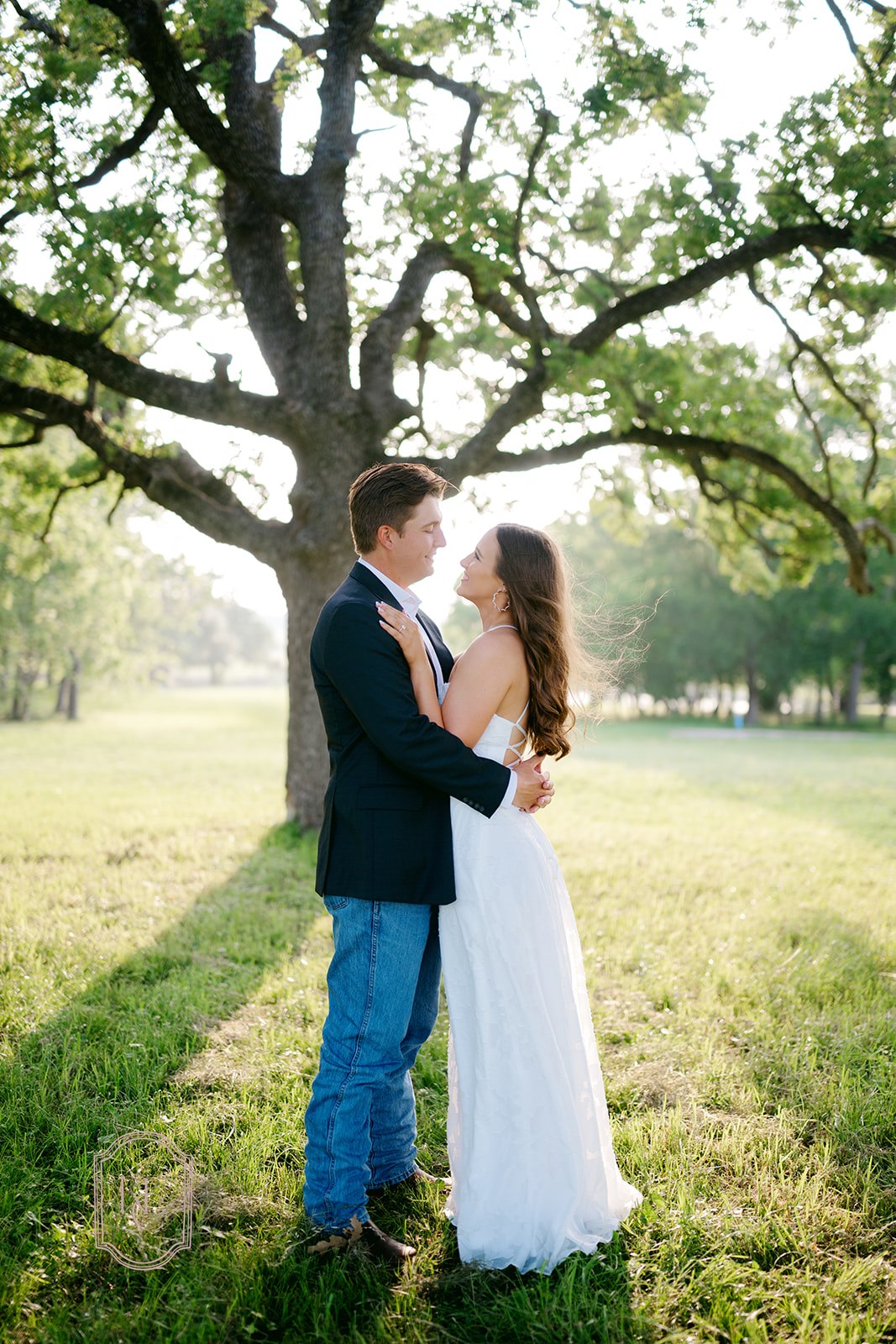 Couple embraces at outdoor engagement photoshoot