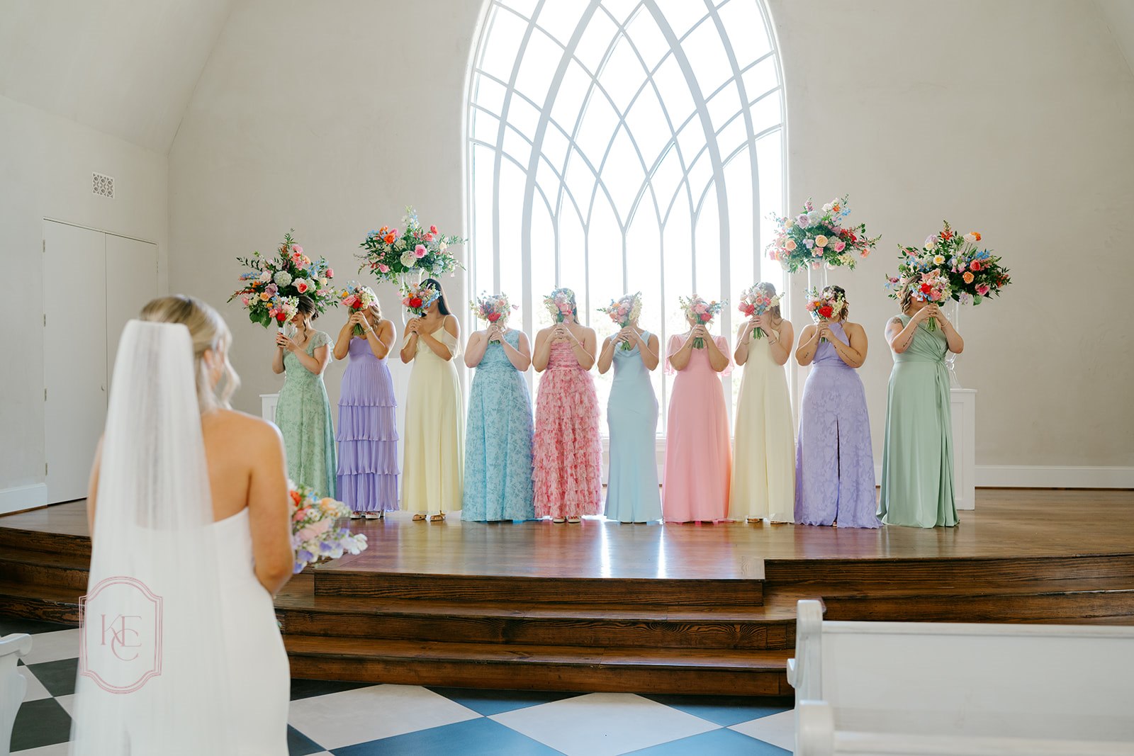 Bridesmaids in pastel dresses at the colorful wedding