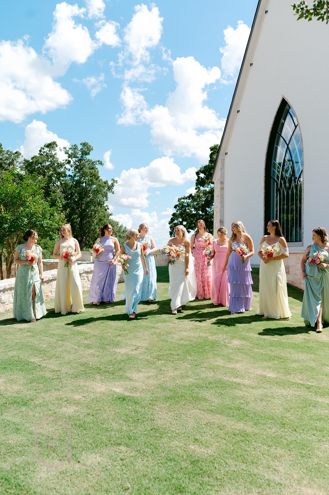 Bridesmaids in pastel dresses at the colorful wedding